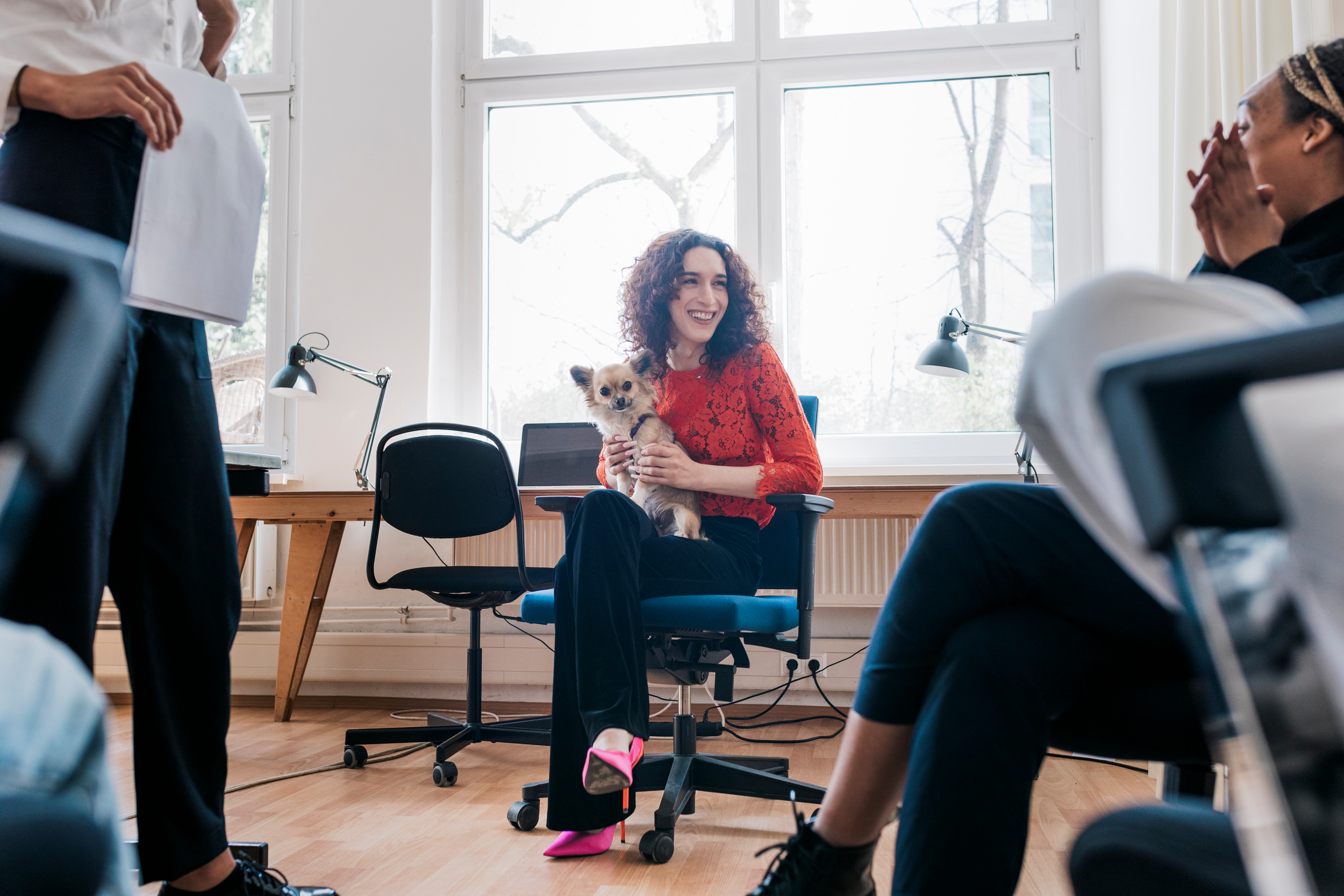 Women sitting with dog.
